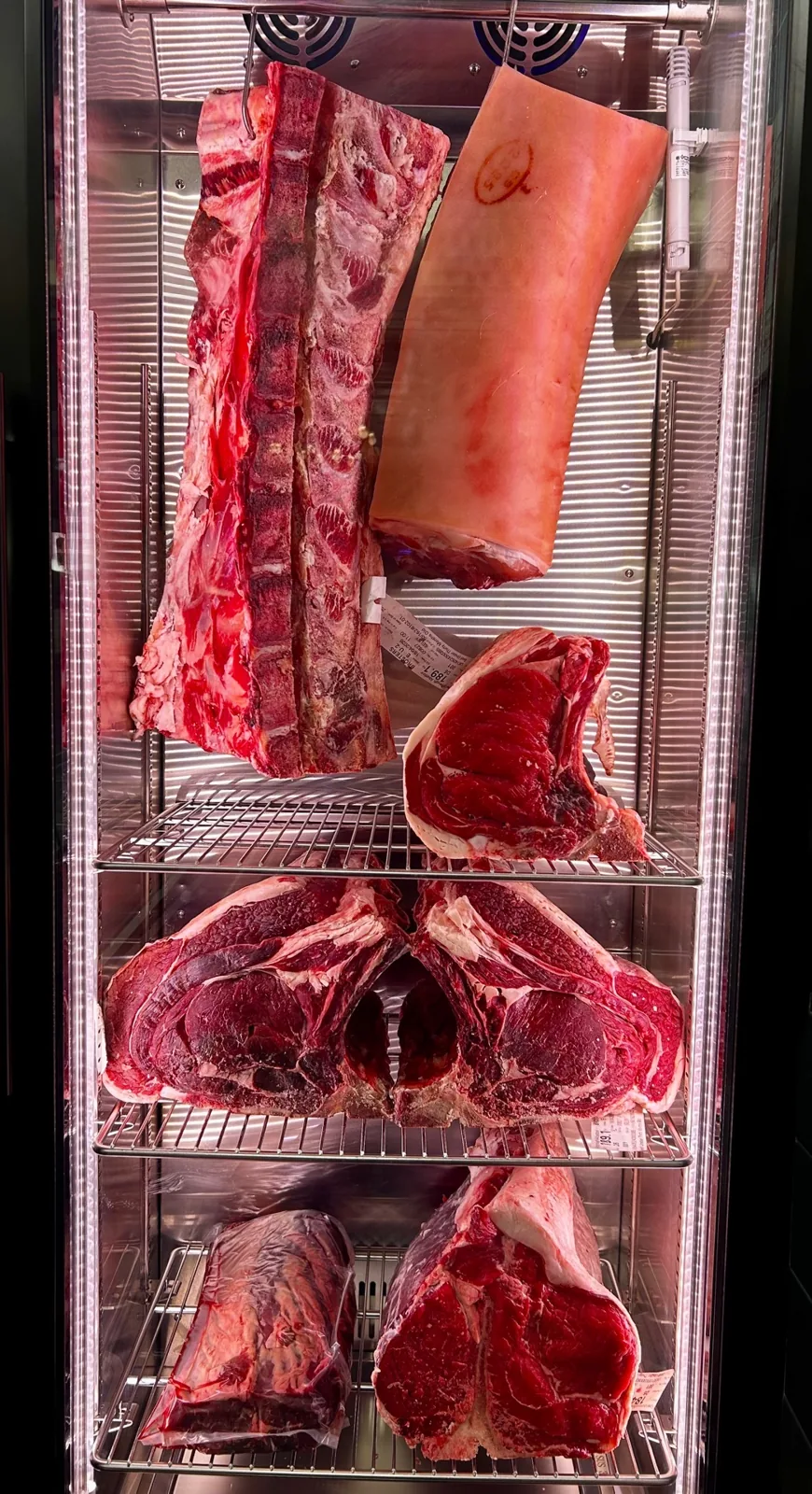 Dry-aged beef hanging in the in-store dry-aging cabinet at The Butchers Blade, Sandbach